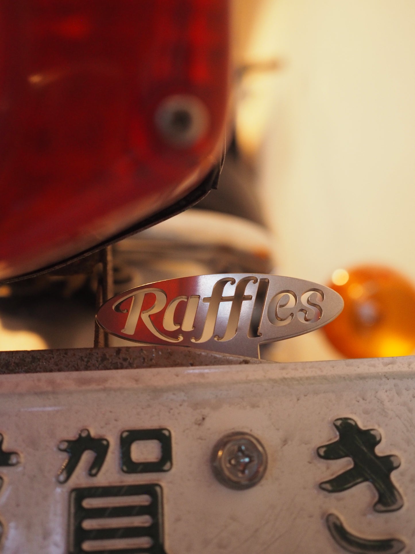 Raffles original license plate topper